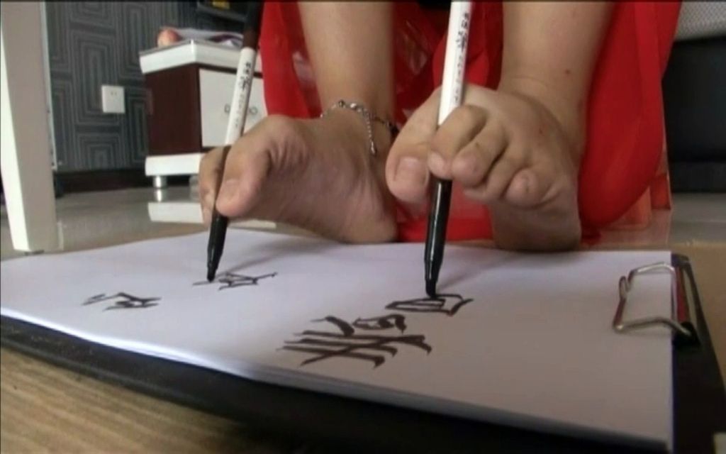 image of foots which write with pen